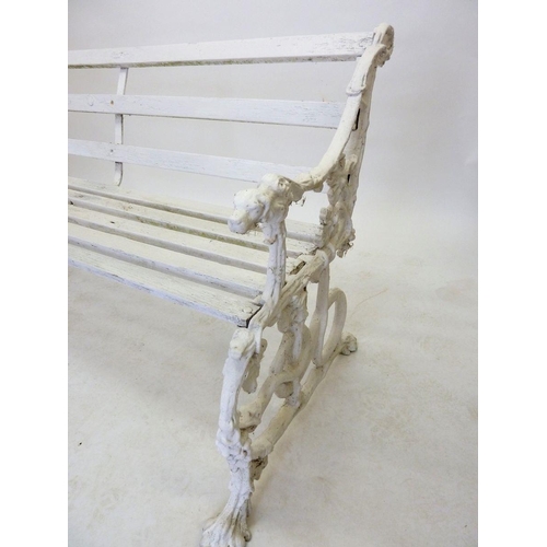 1137 - A Victorian Coalbrookdale style garden bench with dogs head arm rests and scrolling vines, 146cm wid... 