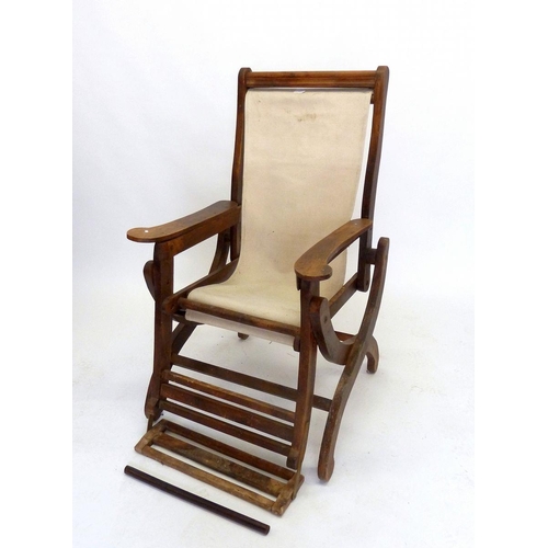 1183 - An early 20th century large folding slatted wood garden deck or liner chair with foot rest