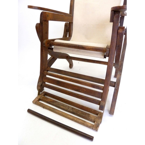 1183 - An early 20th century large folding slatted wood garden deck or liner chair with foot rest