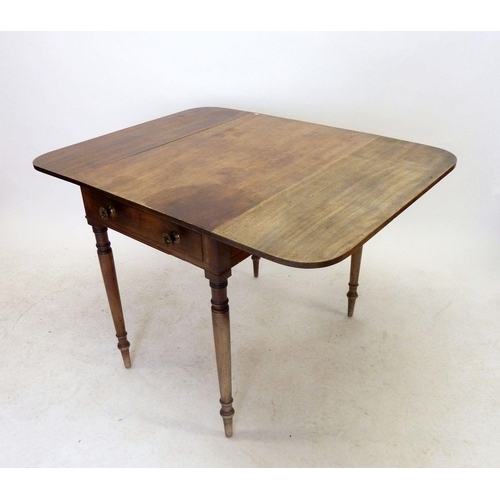 1187 - An early 19th century mahogany Pembroke table on turned supports