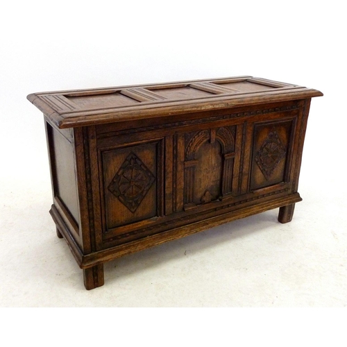 1191 - A small oak panelled coffer, 90cm wide