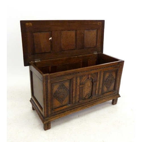 1191 - A small oak panelled coffer, 90cm wide