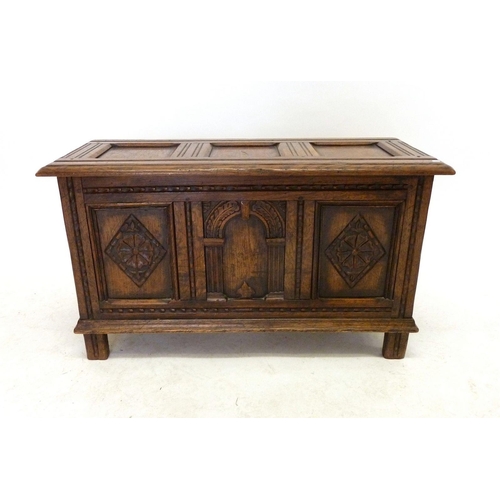 1191 - A small oak panelled coffer, 90cm wide