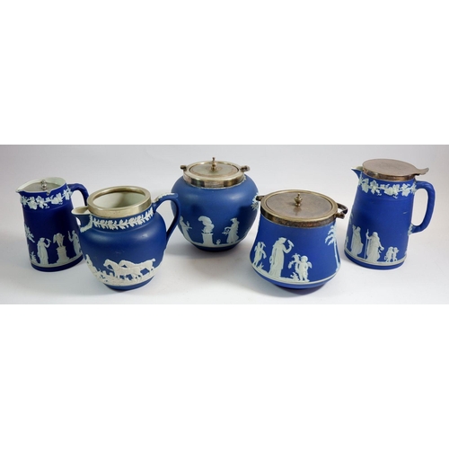 12 - A Wedgwood group of early 20th century Jasperware comprising two biscuit barrels, two water jugs and... 