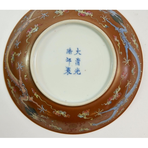 144 - A pair of Chinese Kang Xi saucers paitned Babao and Shou symbols with 'Da Qing Guang Xu Nian Zhi mar... 