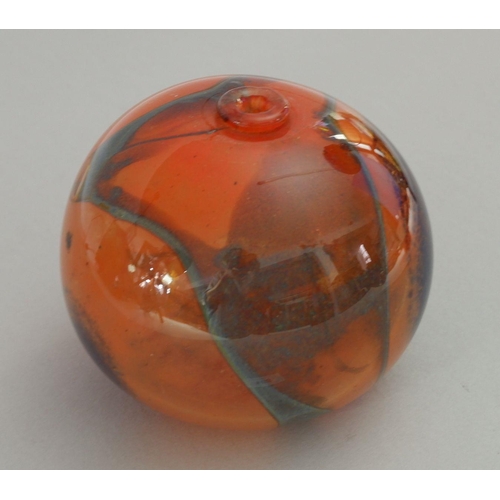 168 - A studio glass 'Red Sphere' by Pauline Solven, 1975, signed and dated, 12cm tall