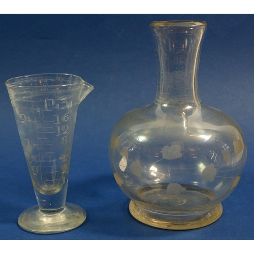 178 - A glass medicine measure and a glass carafe