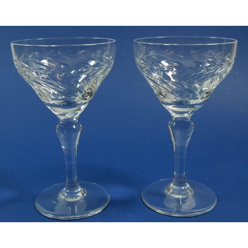 194 - A set of six cut glass champagne glasses