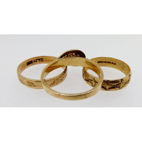 303 - Two 9 carat wedding rings, a 9 carat gold ring set white stone and a 9 carat gold expanding bracelet... 