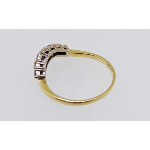 347 - An 18 carat gold ring set curve of seven diamonds, size M