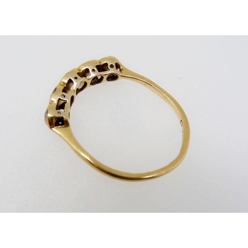 348 - An Edwardian 18 carat gold ring set five diamonds, size J