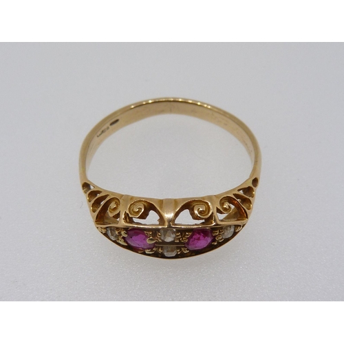 359 - An 18 carat gold ring set two rubies and four diamonds, Size T