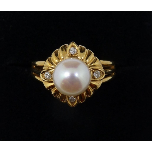 362 - An 18 carat gold ring set pearl with gadrooned surround set four diamonds, size L, 4.3g