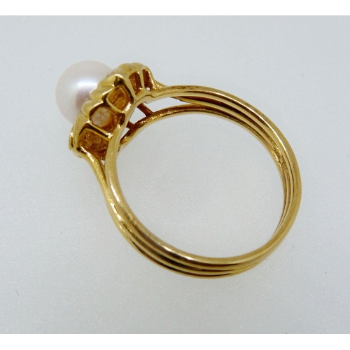 362 - An 18 carat gold ring set pearl with gadrooned surround set four diamonds, size L, 4.3g