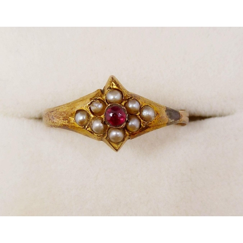 365 - An Edwardian 9ct gold ring set red stone in seed pearl lozenge surround, size K