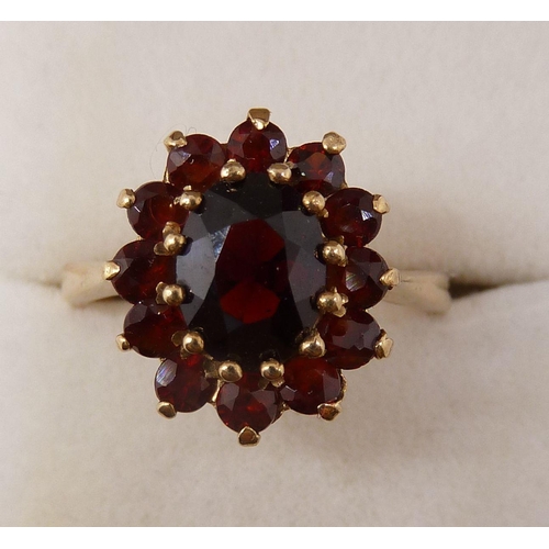 369 - A 9 carat gold garnet cluster ring, size M-N, 3.7g