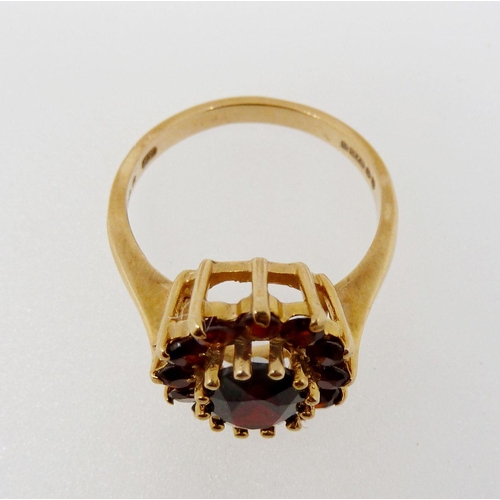 369 - A 9 carat gold garnet cluster ring, size M-N, 3.7g