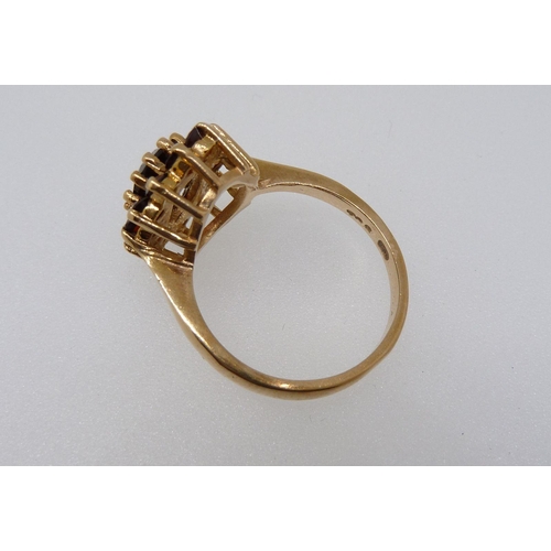 369 - A 9 carat gold garnet cluster ring, size M-N, 3.7g