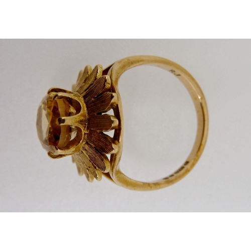 371 - A 9 carat gold ring set oval cut citrine within gold petal form surround, size M, 4.1g