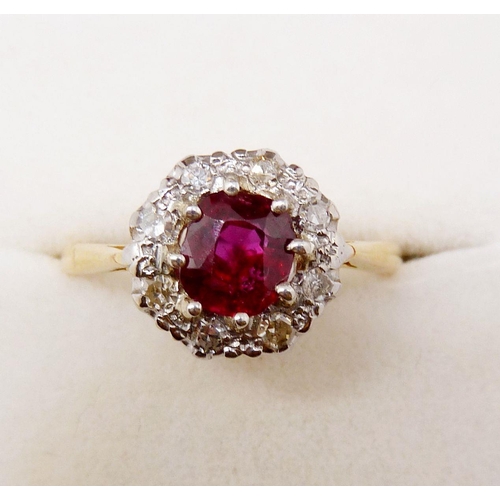 374 - An 18 carat gold ruby and diamond cluster ring, size N