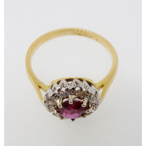 374 - An 18 carat gold ruby and diamond cluster ring, size N