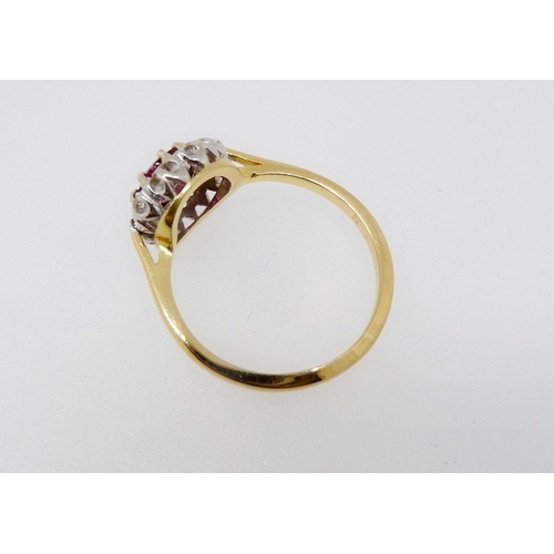 374 - An 18 carat gold ruby and diamond cluster ring, size N