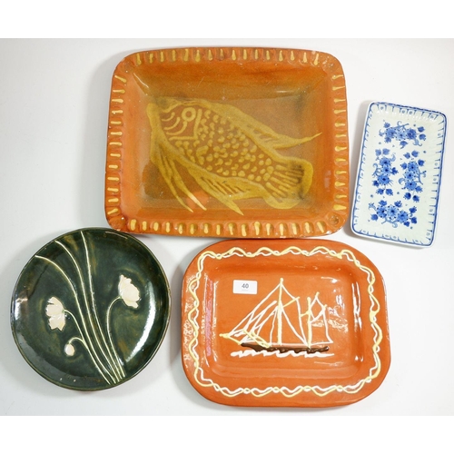 40 - Two slipware platters (largest 39cm wide) and two other serving dishes