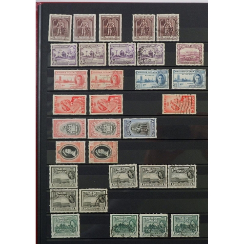 565 - British Guiana: QV-QEII mint & used in 16 page red stock-book. Defin, commem, official & postal fisc... 