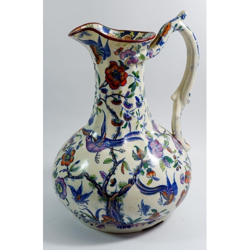 6 - A Victorian toiletry jug with exotic bird decoration and intertwined handle, 32cm