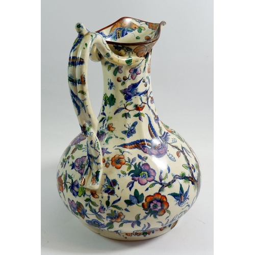 6 - A Victorian toiletry jug with exotic bird decoration and intertwined handle, 32cm