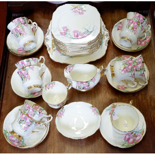 61 - A Paragon tea service painted and printed fox gloves comprising: twelve cups and saucers, twelve tea... 