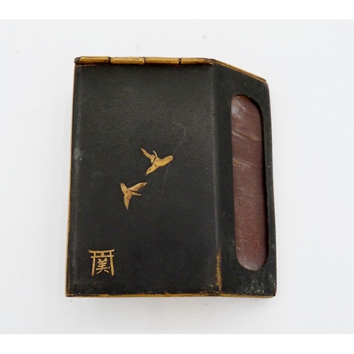 818 - A Japanese black and gilt metal vesta case and Bride 'Bakelite' table lighter