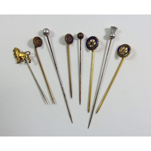 826 - A group of stick pins, needle case and Queen Elizabeth medallion plus a revolving musical lipstick h... 