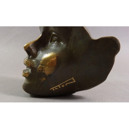 852 - A limited edition bronze mask, signed Taton 9cm tall