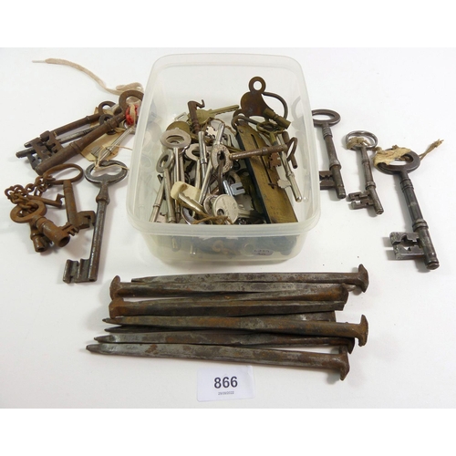 866 - A box of large iron nails and keys etc