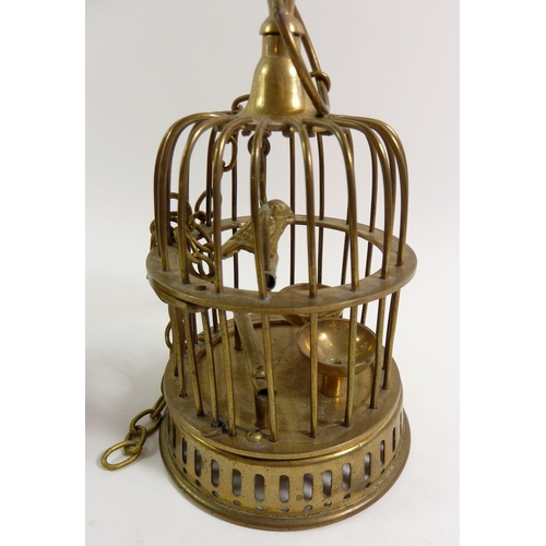 874 - A brass candelabra and a brass miniature bird cage