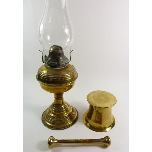 901 - A brass pestle and mortar 9.5cm tall and a brass oil lamp