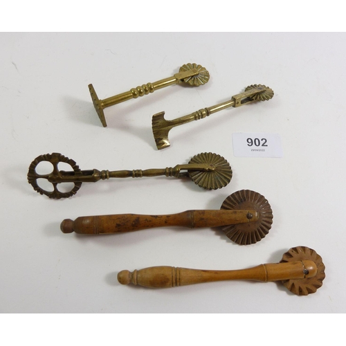 902 - Three antique brass pastry wheel cutters and crimpers and two wooden ones