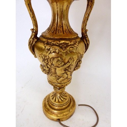 922 - A gilt urn form table lamp decorated cherubs, base 30cm tall