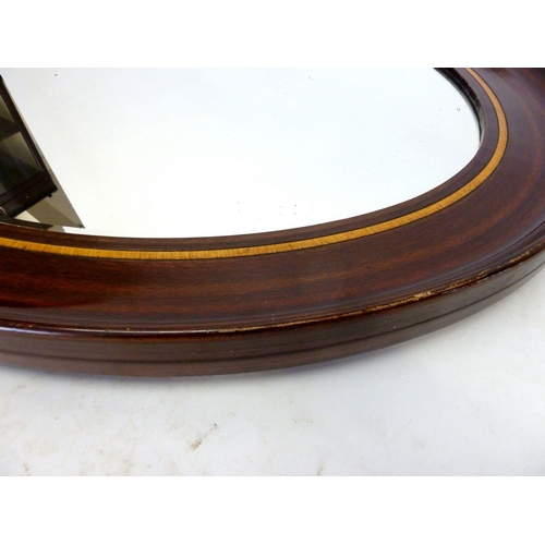 924 - A large oval mahogany framed mirror with satinwood inlay, 89 x 65cm