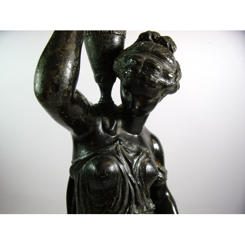 947 - A painted spelter figure of a water carrier, 56cm tall