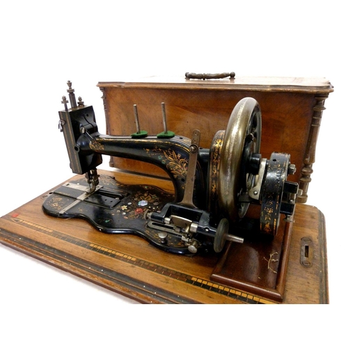 949 - An antique sewing machine with inlaid mother of pearl and painted decoration in inlaid case