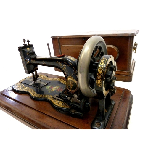 950 - An Edwardian floral painted sewing machine