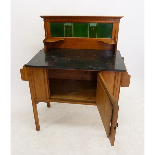 951 - An Edwardian satin walnut washstand with marble top and green Aesthetic Movement style tile back