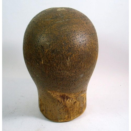 975 - A 1920's Art Deco carved wood milliners block with incised features, 17cm tall