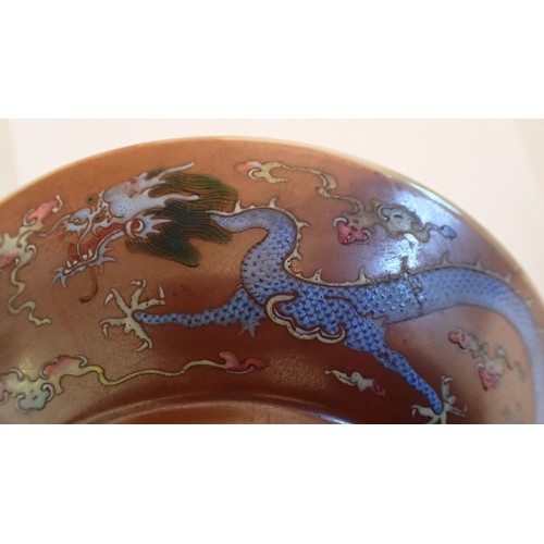 144 - A pair of Chinese Kang Xi saucers paitned Babao and Shou symbols with 'Da Qing Guang Xu Nian Zhi mar... 