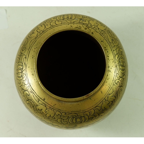 1001 - A Chinese 20th century brass incense burner engraved traditional good fortune decoration within pane... 