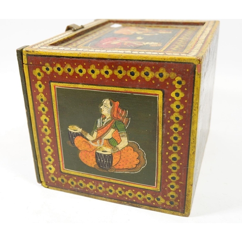 1042 - An Indian painted wooden box with figures to top and sides, the drop front enclosing drawers, 18cm w... 