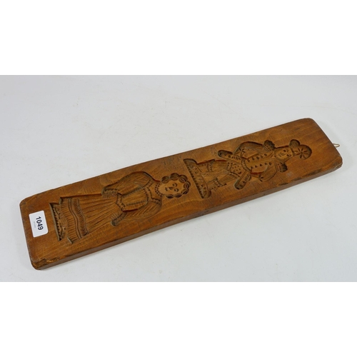 1049 - An early 19th century gingerbread mould, 52cm