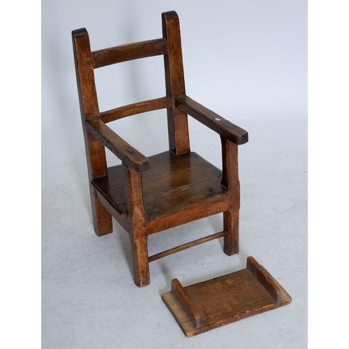 1056 - An 18th century continental elm seated child's chair with later table tray